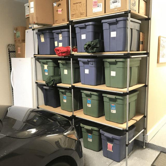DIY Pipe Shelving System Used To Store Bins
